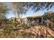 Landscaped backyard with patio and trees at 26175 W Firehawk Dr, Buckeye, AZ 85396