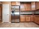 Kitchen features stainless steel refrigerator and pantry at 26175 W Firehawk Dr, Buckeye, AZ 85396