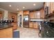 Bright kitchen boasts stainless steel appliances and granite countertops at 26175 W Firehawk Dr, Buckeye, AZ 85396