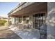 Covered patio with seating area and grill at 26175 W Firehawk Dr, Buckeye, AZ 85396