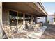 Covered patio with seating area and grill at 26175 W Firehawk Dr, Buckeye, AZ 85396