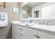 Elegant bathroom boasts a double vanity with marble countertop and modern fixtures at 2626 E Bear Creek Ln, Phoenix, AZ 85024