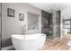 Modern bathroom with soaking tub and walk-in shower at 2626 E Bear Creek Ln, Phoenix, AZ 85024