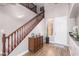 Elegant entryway with wooden staircase and flooring at 2626 E Bear Creek Ln, Phoenix, AZ 85024