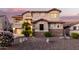 Two-story house with stone accents and landscaping at 2626 E Bear Creek Ln, Phoenix, AZ 85024