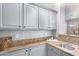 Kitchen with granite countertops and gray cabinets at 2626 E Bear Creek Ln, Phoenix, AZ 85024