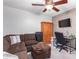 Home office features a comfortable sectional sofa, a work desk, and ample storage at 2626 E Bear Creek Ln, Phoenix, AZ 85024