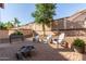 Charming backyard patio with a fire pit and comfortable seating at 2626 E Bear Creek Ln, Phoenix, AZ 85024