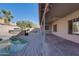 Backyard patio featuring a built-in grill, grassy area and desert landscaping at 2848 E Menlo St, Mesa, AZ 85213