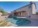 Spacious backyard with private pool, covered patio, and lush desert landscaping at 2848 E Menlo St, Mesa, AZ 85213