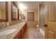 Bathroom with double vanity, granite counters and tile flooring at 2848 E Menlo St, Mesa, AZ 85213