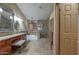 Spacious bathroom offers double vanity, soaking tub and glass enclosed shower at 2848 E Menlo St, Mesa, AZ 85213