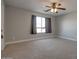 Bedroom with neutral carpet, baseboards and trim at 2848 E Menlo St, Mesa, AZ 85213