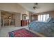 Primary bedroom with vaulted ceiling, vintage furniture and neutral carpet at 2848 E Menlo St, Mesa, AZ 85213