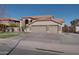 Beautiful two-story home with a three-car garage, manicured lawn, and desert landscaping at 2848 E Menlo St, Mesa, AZ 85213