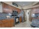 This kitchen features stainless steel appliances and stone countertops at 2848 E Menlo St, Mesa, AZ 85213