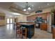 Well-lit kitchen features a large island with bar seating and stainless steel appliances at 2848 E Menlo St, Mesa, AZ 85213