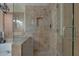 Modern glass-enclosed shower with tiled walls and built-in niche at 2848 E Menlo St, Mesa, AZ 85213