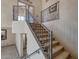 Carpeted staircase featuring ornate wrought iron railing at 2848 E Menlo St, Mesa, AZ 85213