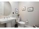 Guest bathroom with pedestal sink and toilet at 3015 E Daley Ln, Phoenix, AZ 85050