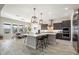 Modern kitchen with large island and stainless steel appliances at 3015 E Daley Ln, Phoenix, AZ 85050