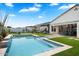 Inviting backyard pool with a spa and grassy area at 3015 E Daley Ln, Phoenix, AZ 85050