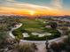 Aerial view of a golf course community at sunset at 30224 N 52Nd Pl, Cave Creek, AZ 85331