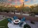 Backyard fire pit and seating area with desert landscape at 30224 N 52Nd Pl, Cave Creek, AZ 85331