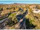 Gated community entrance with landscaped medians and winding roads at 30224 N 52Nd Pl, Cave Creek, AZ 85331