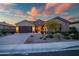 Beautiful home exterior with desert landscaping at dusk at 30224 N 52Nd Pl, Cave Creek, AZ 85331