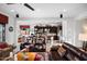 Modern kitchen with dark cabinetry, stainless steel appliances, and breakfast bar at 30224 N 52Nd Pl, Cave Creek, AZ 85331