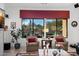 Relaxing living room with large windows overlooking the backyard and comfortable seating at 30224 N 52Nd Pl, Cave Creek, AZ 85331