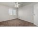 Bright bedroom featuring carpet flooring and ceiling fan at 3511 E Baseline Rd # 1210, Phoenix, AZ 85042