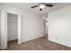 Bedroom with double-door closet and ceiling fan at 3511 E Baseline Rd # 1210, Phoenix, AZ 85042