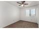 Well-lit bedroom with carpet, ceiling fan, and window at 3511 E Baseline Rd # 1210, Phoenix, AZ 85042