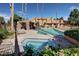 Community pool and spa with surrounding lounge chairs at 3511 E Baseline Rd # 1210, Phoenix, AZ 85042