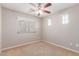 Bedroom with ceiling fan and large window at 3703 W Mccauley Ct, Phoenix, AZ 85086