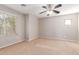 Simple bedroom with ceiling fan and neutral wall colors at 3703 W Mccauley Ct, Phoenix, AZ 85086