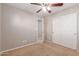 Bright bedroom with ceiling fan and double door closet at 3703 W Mccauley Ct, Phoenix, AZ 85086