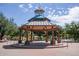 Picturesque community gazebo with intricate clock tower, surrounded by lush greenery and walking paths at 3703 W Mccauley Ct, Phoenix, AZ 85086