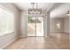 Bright dining area with tiled floors and sliding glass doors leading to a patio at 3703 W Mccauley Ct, Phoenix, AZ 85086