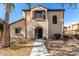 Two-story house with Spanish-style architecture, landscaping, and a walkway at 3703 W Mccauley Ct, Phoenix, AZ 85086