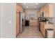 Bright kitchen with stainless steel appliances and light wood cabinets at 3703 W Mccauley Ct, Phoenix, AZ 85086