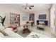 Spacious living room featuring a neutral color palette and comfortable furnishings at 3703 W Mccauley Ct, Phoenix, AZ 85086