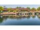 Scenic pond with a waterfall, railroad structure, and gazebo in a tranquil community park at 3703 W Mccauley Ct, Phoenix, AZ 85086