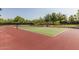 Enjoy outdoor activity on this well-maintained tennis court with a beautiful green surface and surrounding landscape at 3703 W Mccauley Ct, Phoenix, AZ 85086