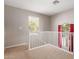 Upstairs hallway with a white railing and carpet flooring at 3703 W Mccauley Ct, Phoenix, AZ 85086