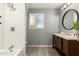 Updated bathroom with subway tile, new vanity, and a large mirror at 4028 W Palo Verde Dr, Phoenix, AZ 85019