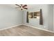 Bright bedroom with ceiling fan, vinyl flooring, and window coverings at 4028 W Palo Verde Dr, Phoenix, AZ 85019