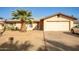 Ranch style home with a two-car garage and desert landscaping at 4028 W Palo Verde Dr, Phoenix, AZ 85019